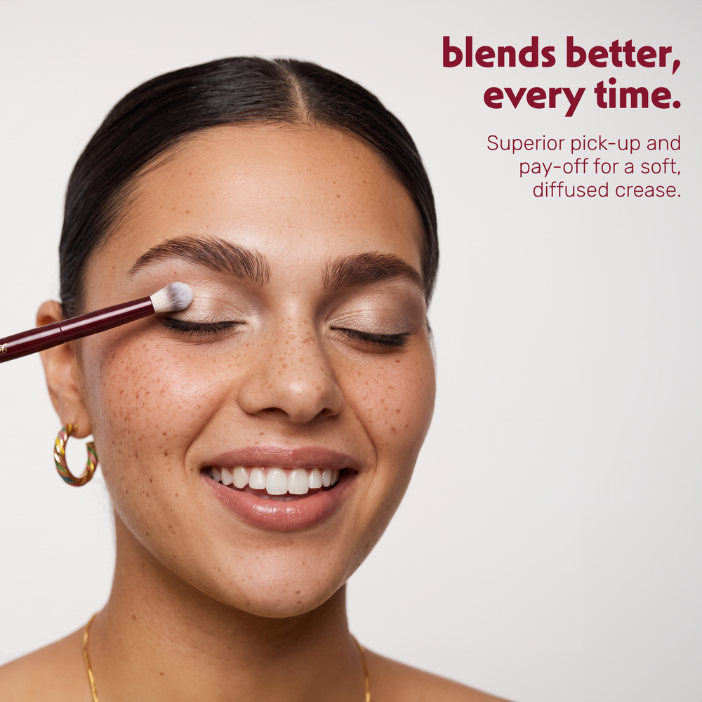 Model blends eyeshadow in the crease with the Boozyshop Flawless Blended Crease Brush