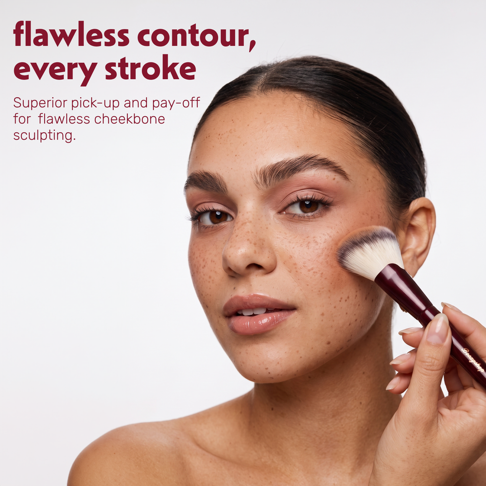 Model applies powder to the face with the Boozyshop Flawless Angled Powder Brush