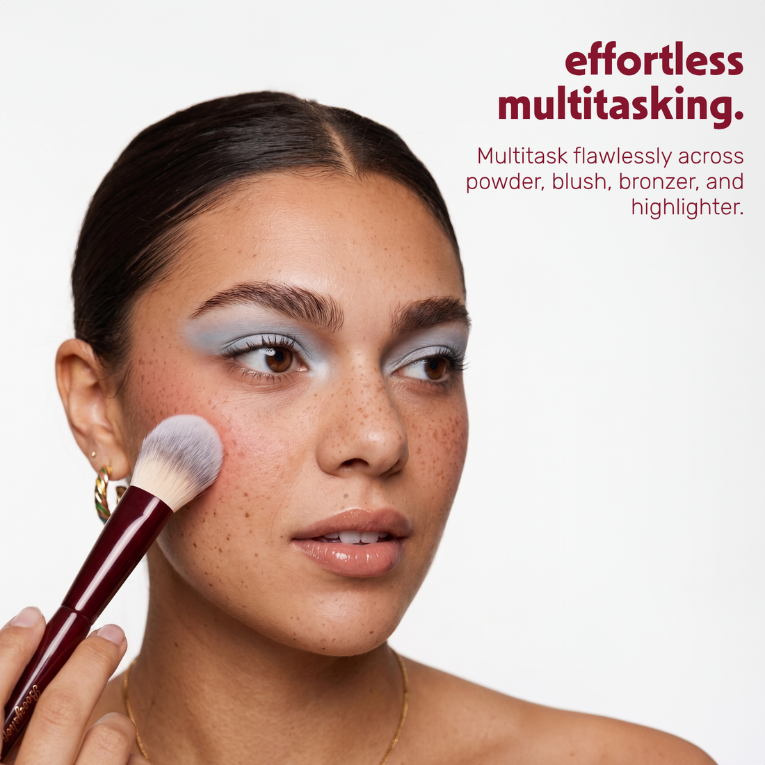 Model applies make-up to the face with the Boozyshop Flawless Multi Face Brush