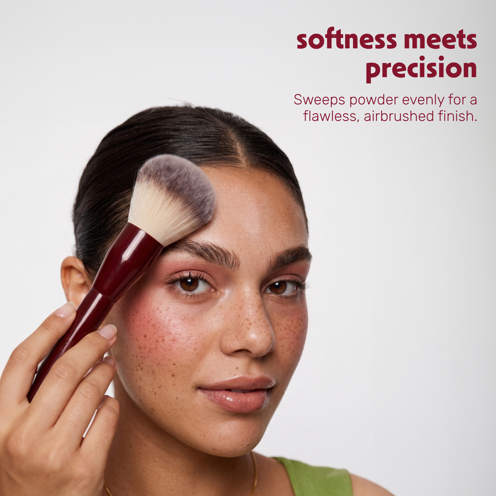 Model applies powder to the face with the Boozyshop Flawless Powder Brush