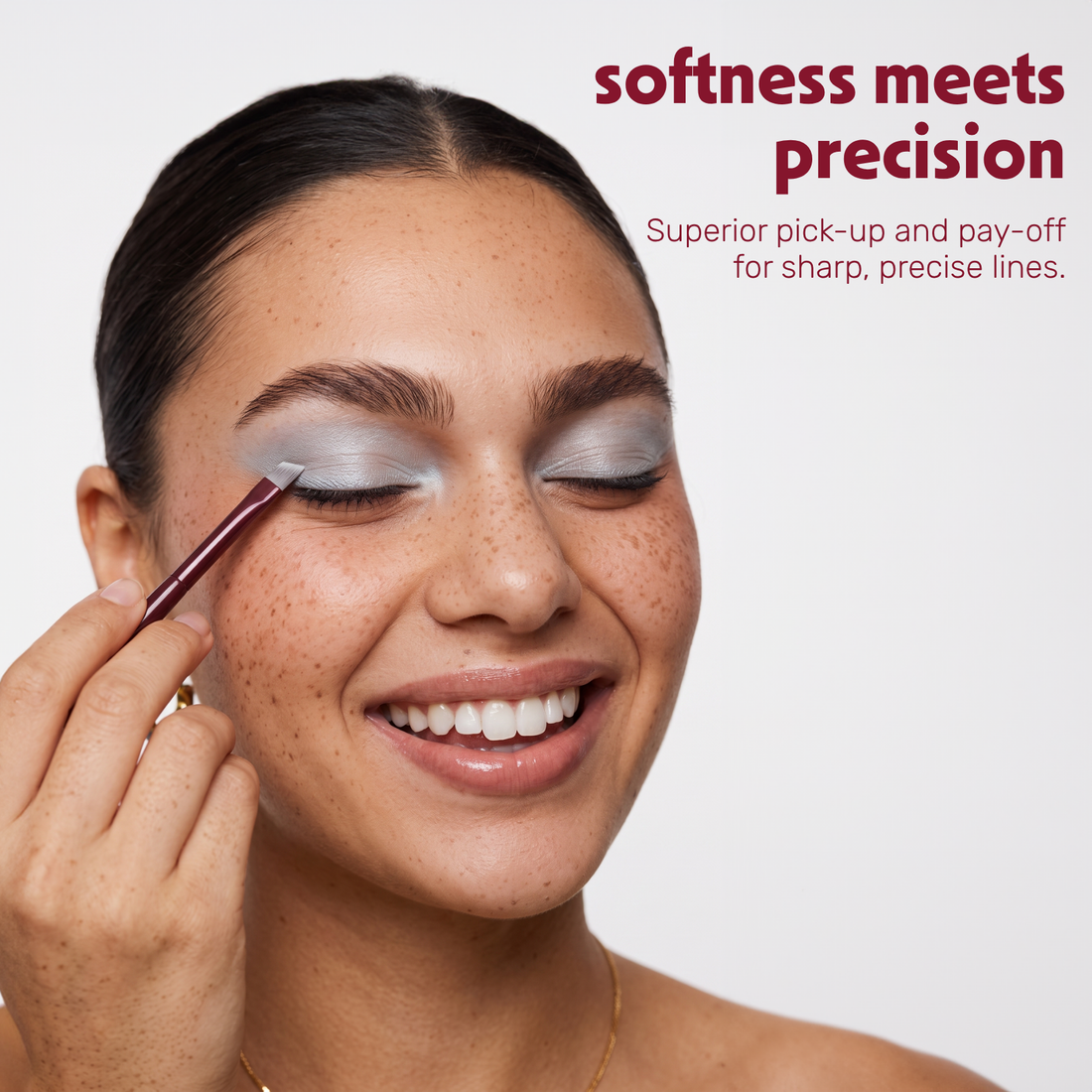 Model applies eye make-up with the Boozyshop Flawless Precision Angle Eye Brush