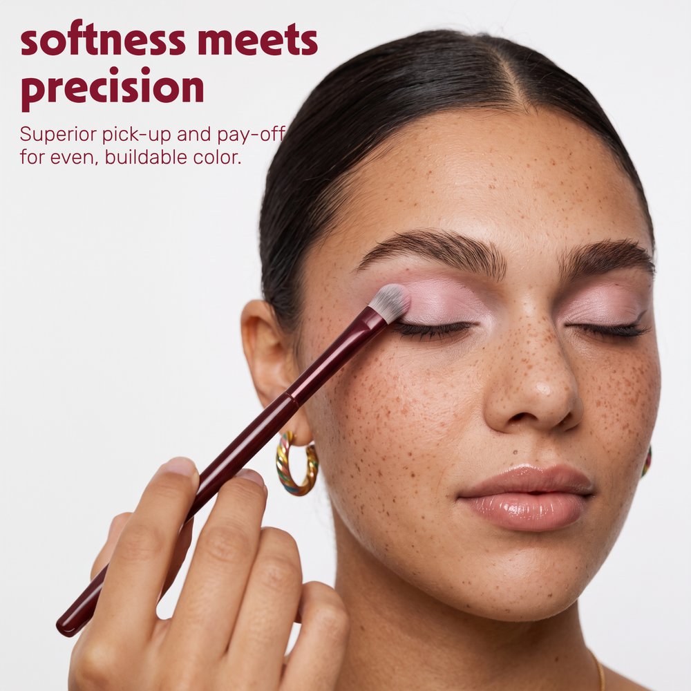 Model applies eyeshadow to the eyelid with the Boozyshop Flawless Shader Brush
