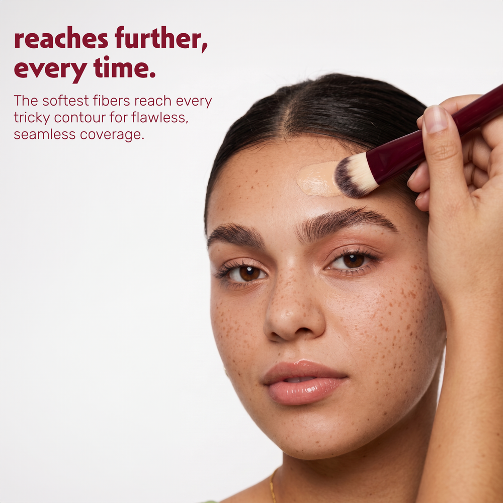 Model applies foundation to the face with the Boozyshop Flawless Small Contoured Foundation Brush